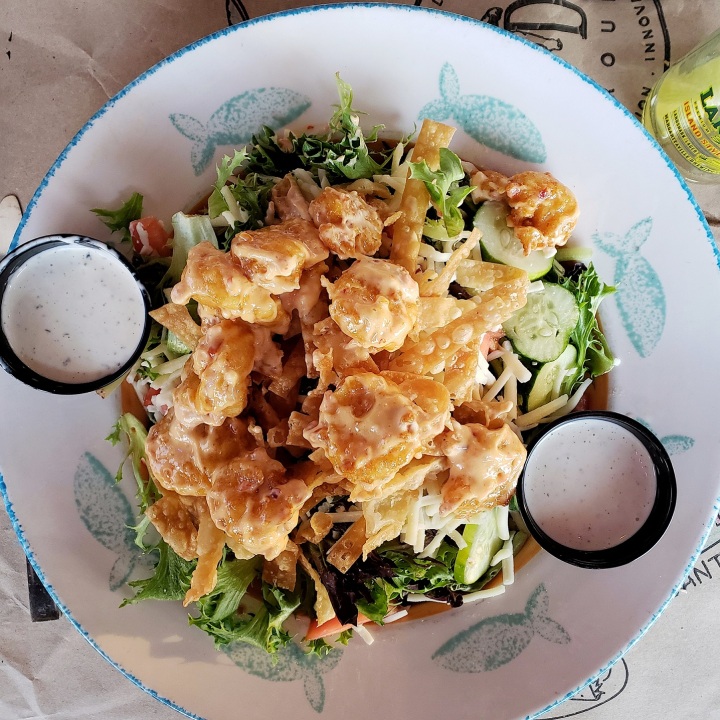 Bangin' Shrimp Salad at Pawley's Raw Bar in Pawley's Island SC (fried shrimp tossed in housemade bangin' sauce, over fresh greens, tomato, cucumber, Monterey Jack, and fried wonton strips)